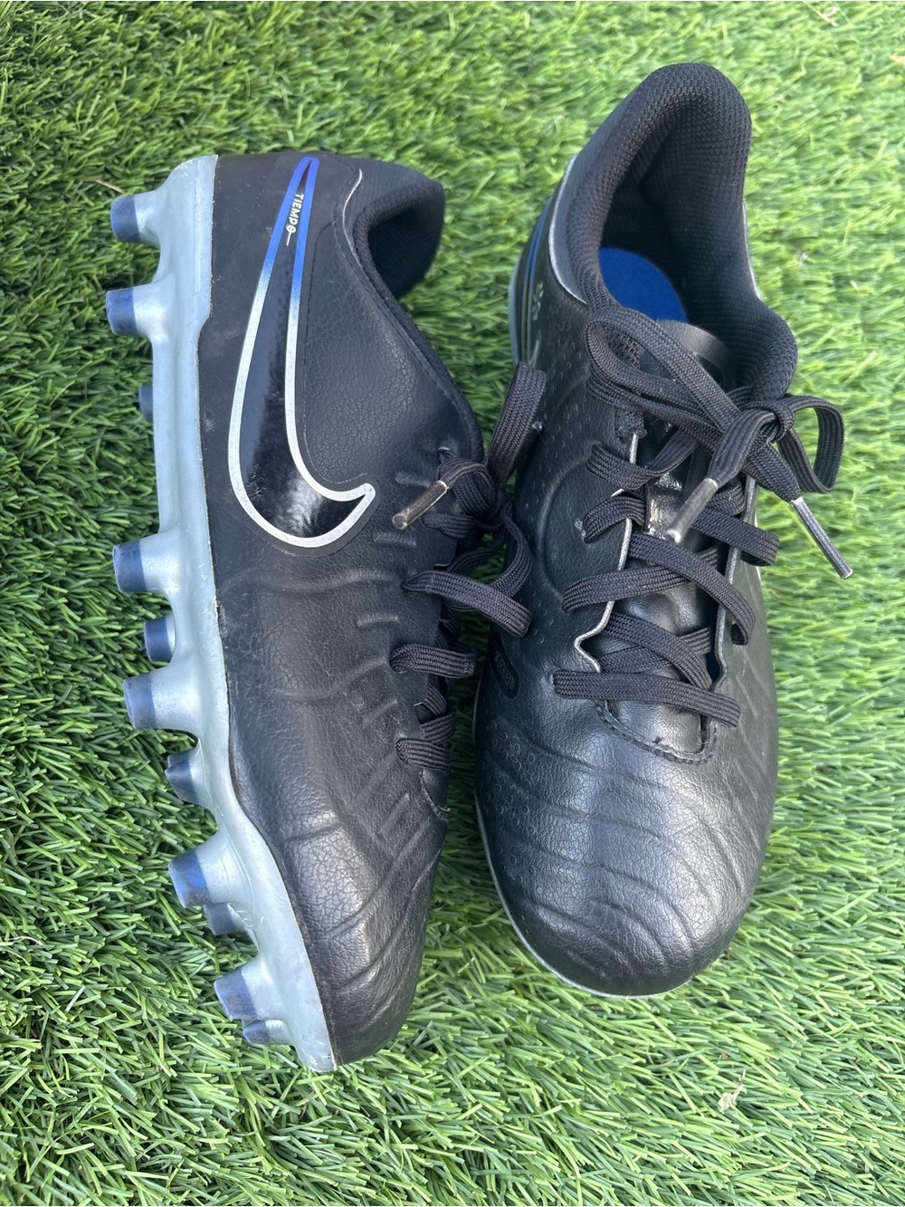 Nike Kids Black Soccer Cleats with Blue Accents